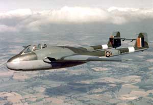 Front left side view of the de Havilland DH.100 Vampire fighter in flight; color