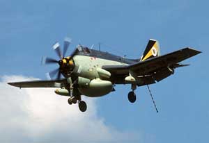 Front left side view of an incoming Fairey Gannet aircraft; color