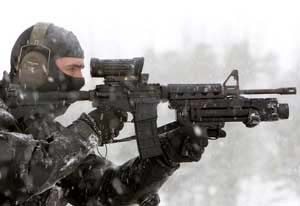 An operator with his fully-laden C8 Carbine assault weapon